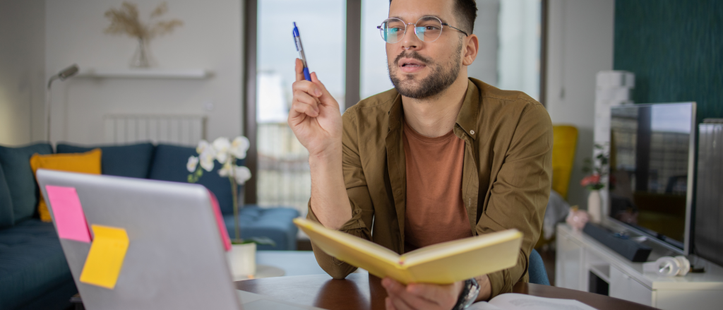 Young professional male taking online leadership classes.